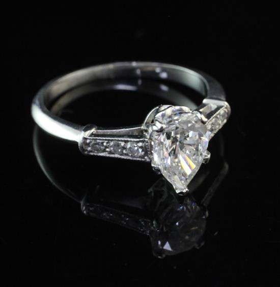 A platinum and single stone pear shaped diamond ring, size L.